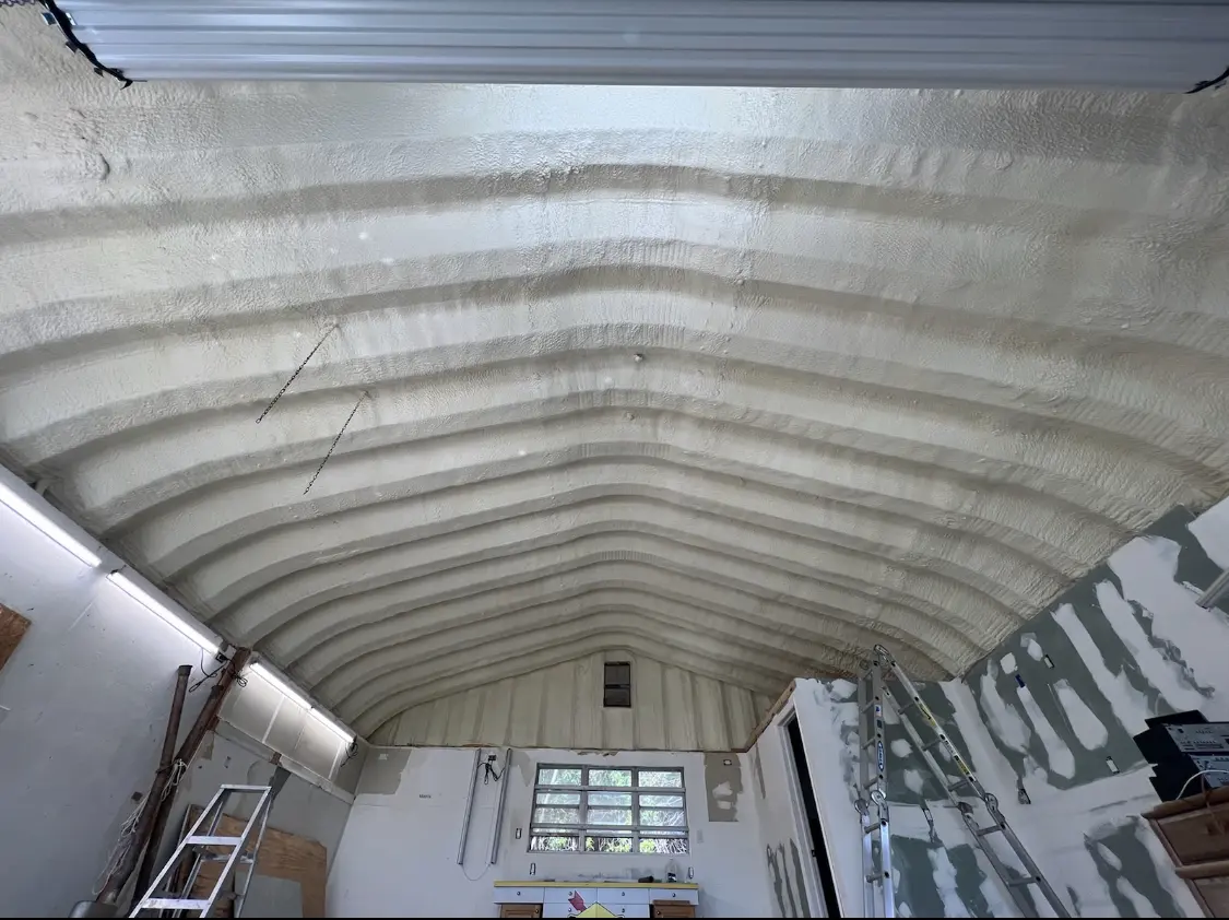 Spray polyurethane foam applied to the underside of a metal roof deck in Carrollwood